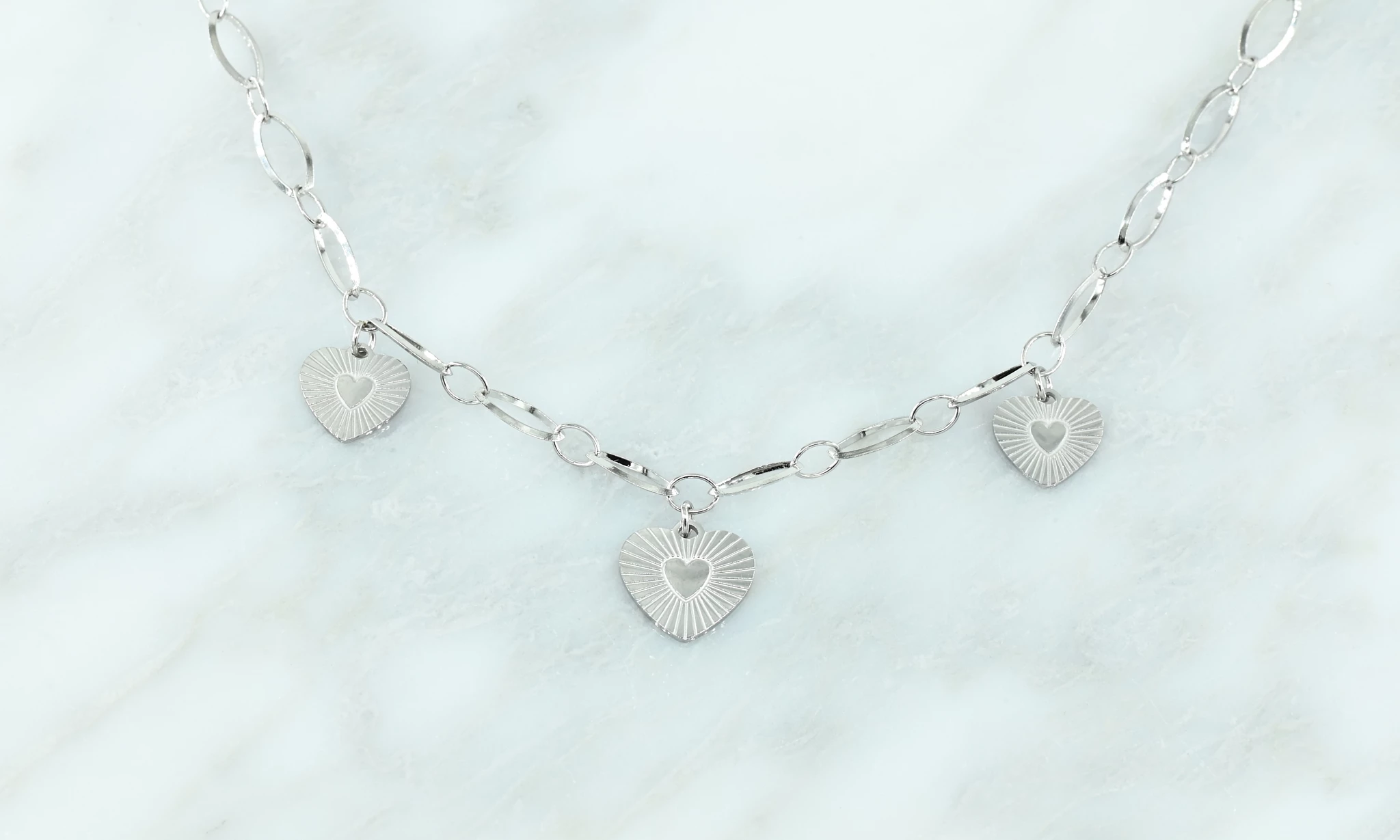 Zilver ketting met hart bedeltjes