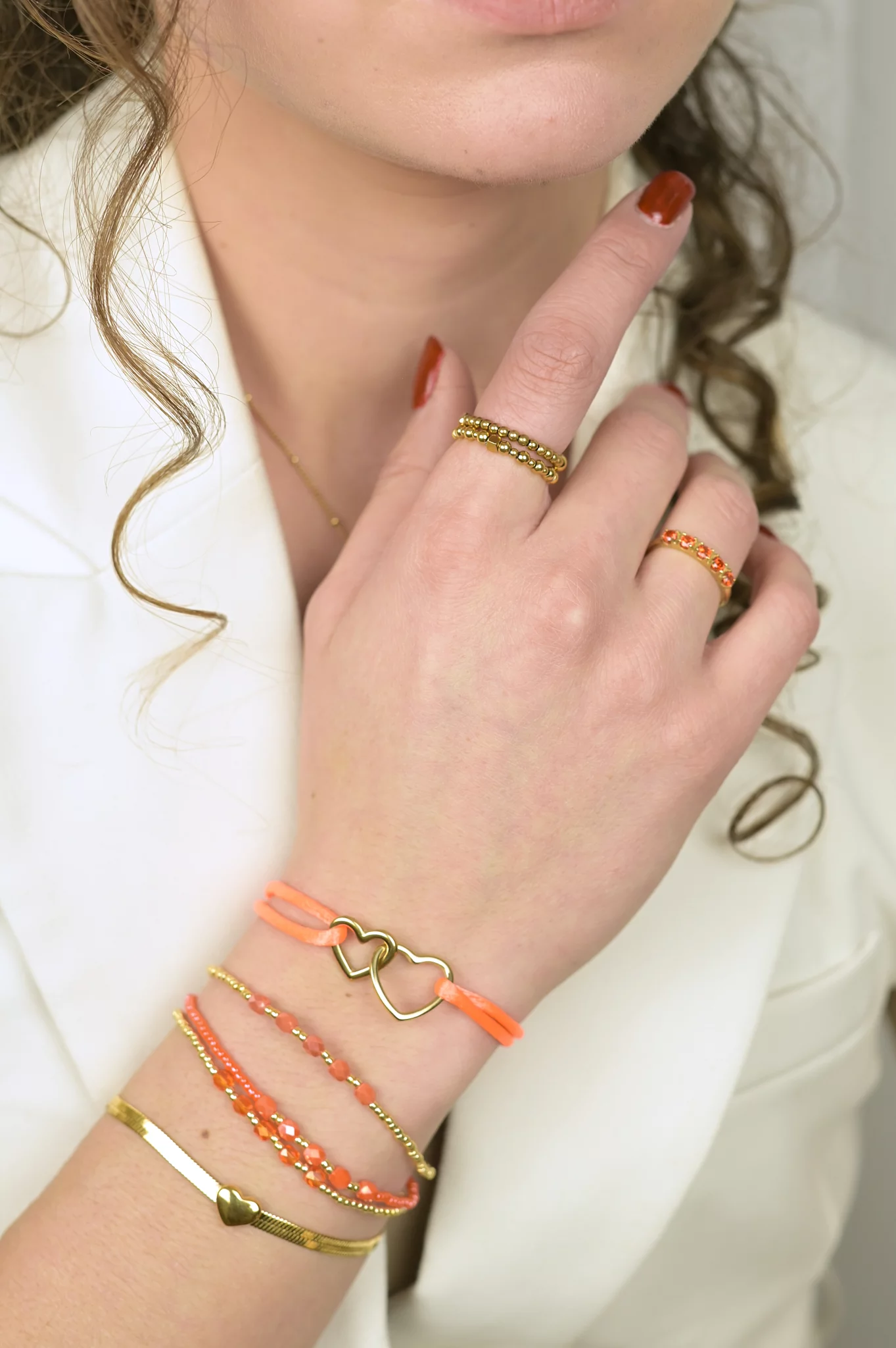 3 oranje kralenarmbandjes